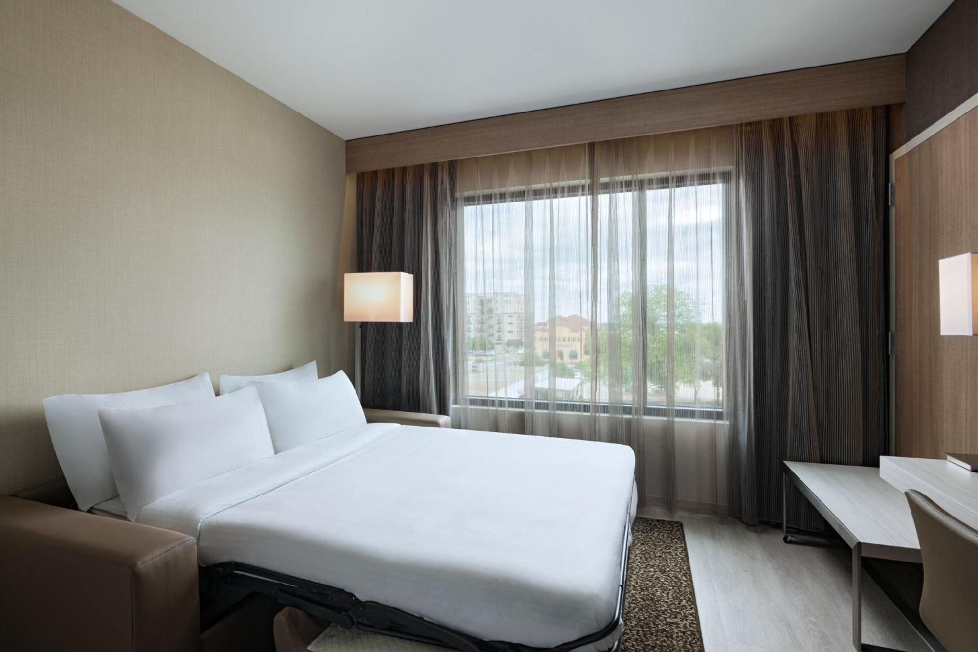 Deluxe King Room Sofa Bed City View